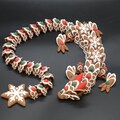 Discover the 25-inch long 3D-printed articulated gingerbread dragon. This unique piece will add a fun touch to your decor.